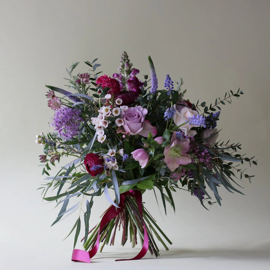 A Catkin & Pussywillow favourite combination bringing all of the colours and scents of an English Country Garden into your mum’s home. Created with memory lane & double cream vendella roses mixed with rosemary, lavender & mint along with clematis, ranunculus, hellebore, astrantia roma, lilacs, strawberry scabious, veronica, muscari & waxflower.